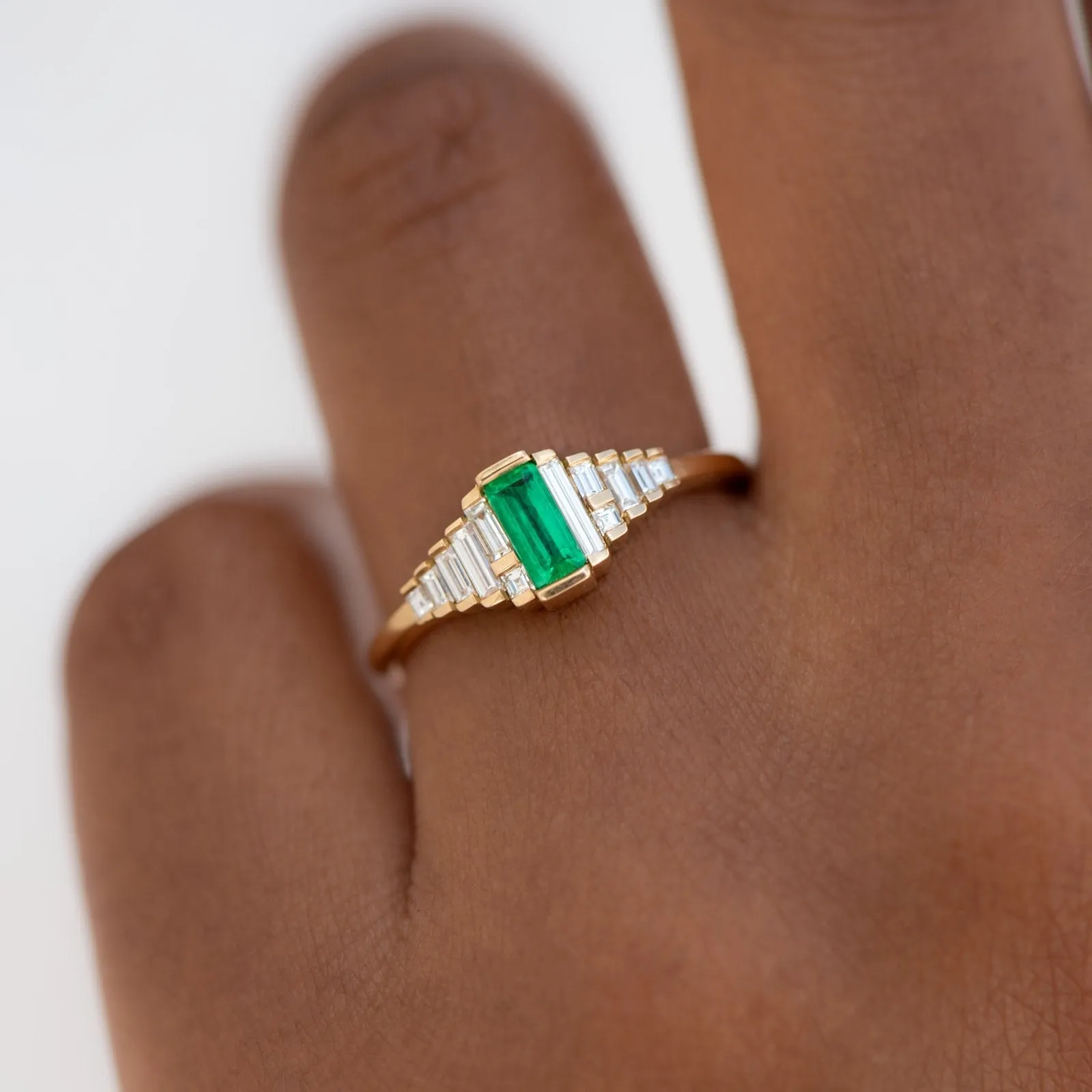 18K Gold and Emerald Ring with Graduated Needle Baguette Diamonds